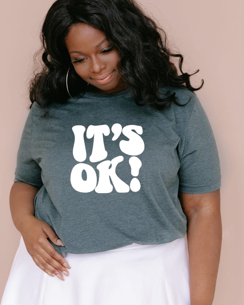 Front of a model wearing a size Large It's Ok in Forest by Simply Sage Market. | dia_product_style_image_id:281508